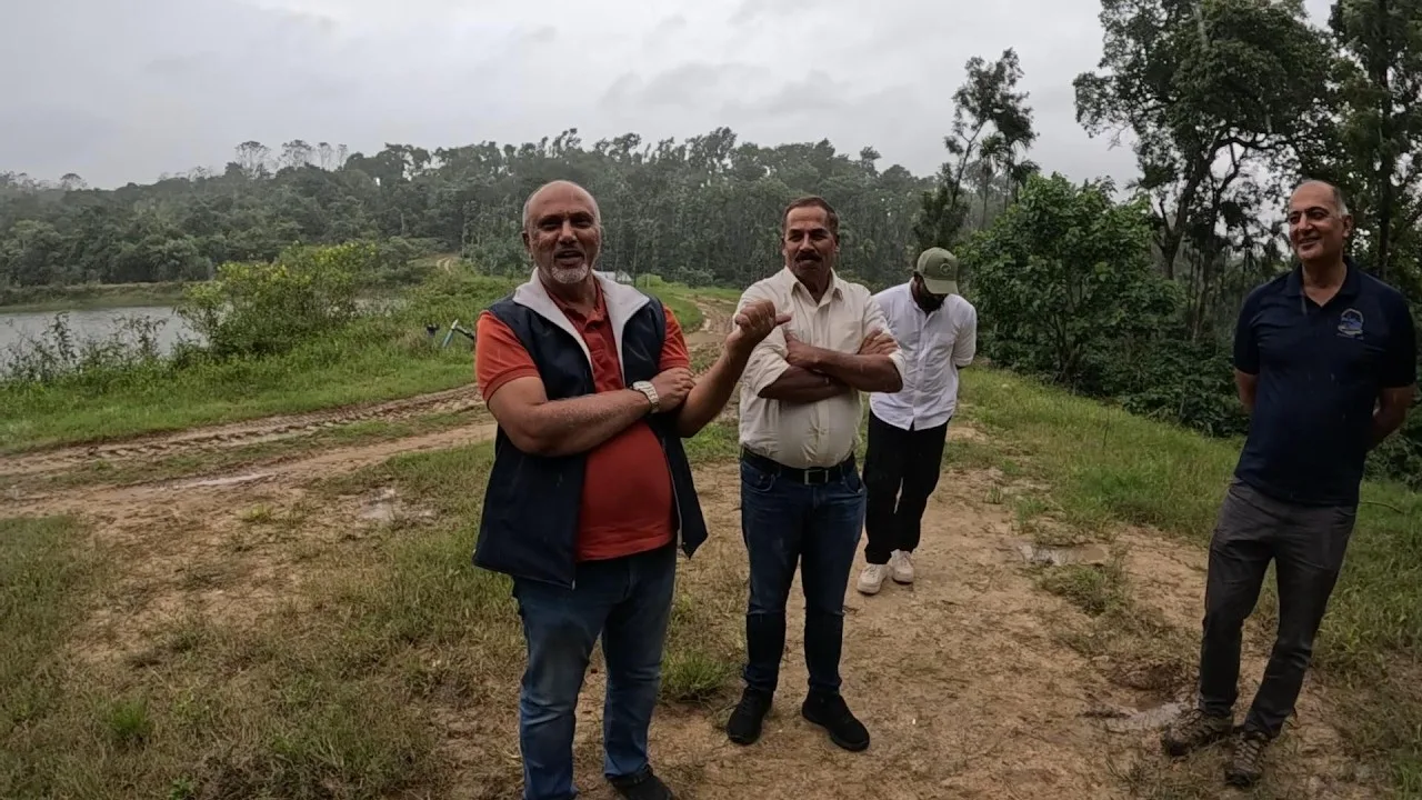 Shricharan Jayaram with Karthik Pattada and Naresh on the estate track above one of the ponds, filmed in rain